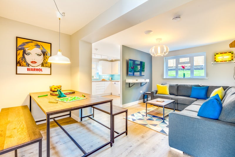 Photo 1: Open plan living area and TV with Netflix etc