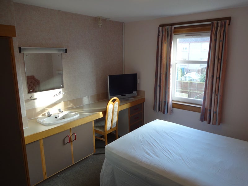 Photo 1: Double Bedroom with Sink and TV