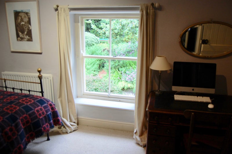 Photo 1: bedroom with garden view