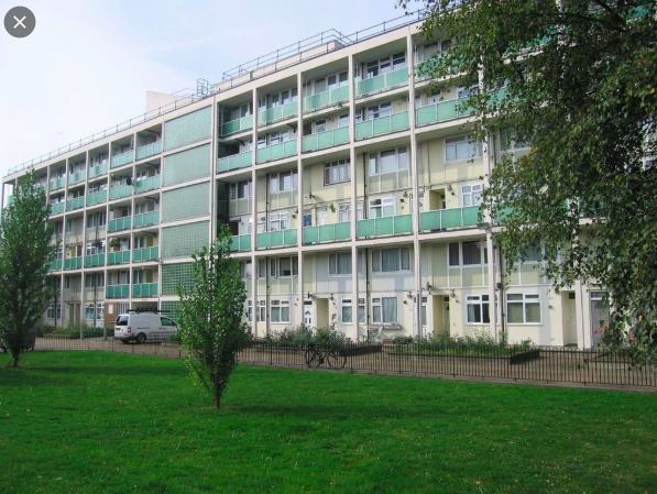 Photo 1: View of the apartment block