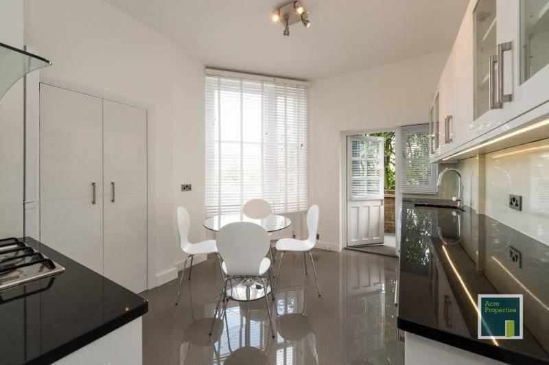 Photo 1: Open plan kitchen, dining