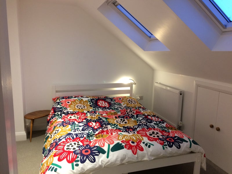 Photo 1: Large furnished room with loft storage space, desk and wardrobes