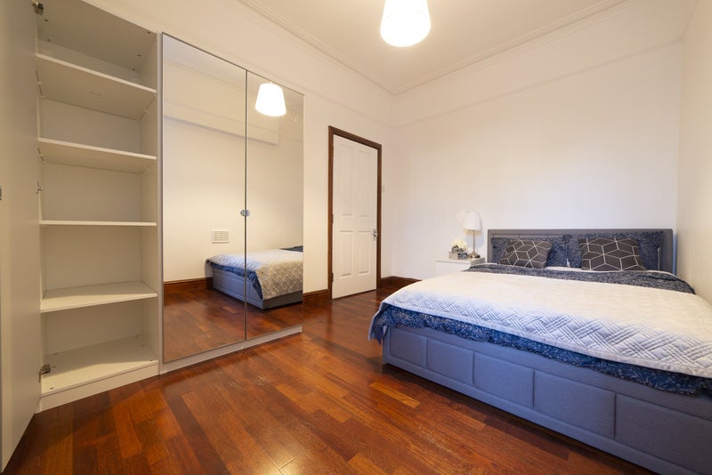 Photo 1: The room with a view of the triple wardrobe with both shelf space (the door is open showing this) an