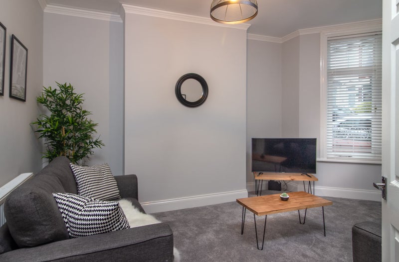 Photo 1: Shared lounge area