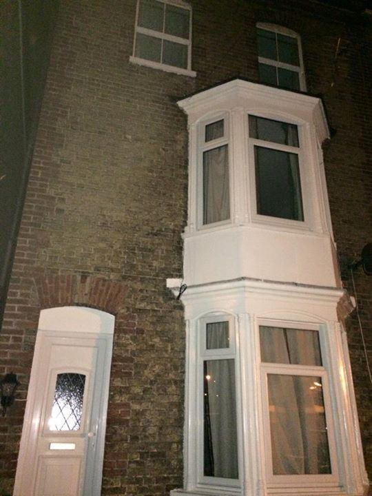 Photo 1: The exterior of the house
