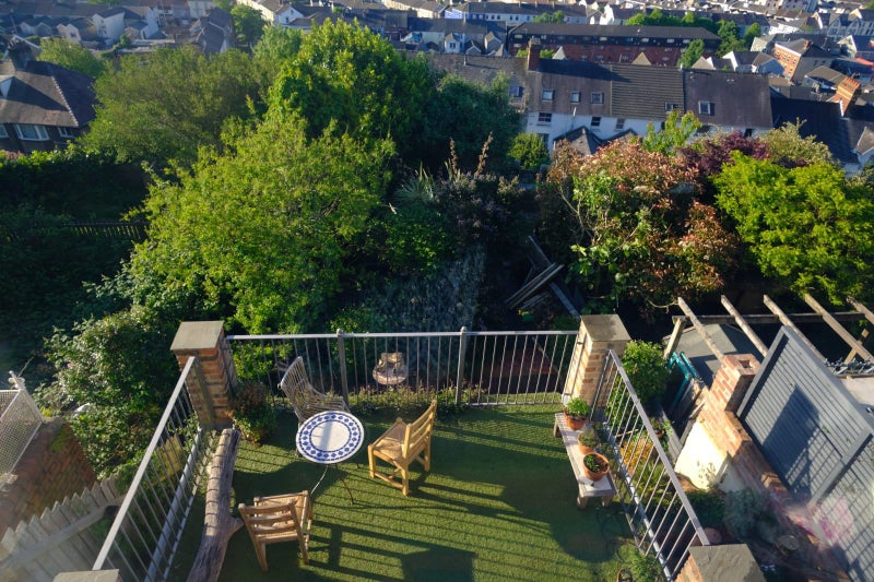 Photo 1: Communal balcony/garden overlloking bay