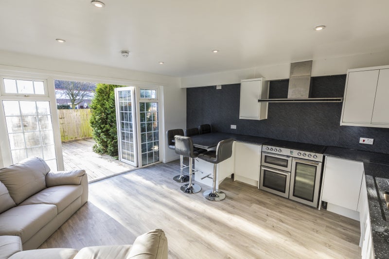 Photo 1: Communal area and Kitchen