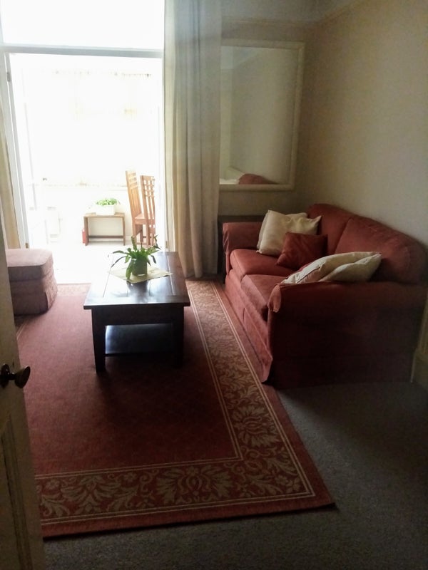 Photo 1: living room with doors to consvervatory