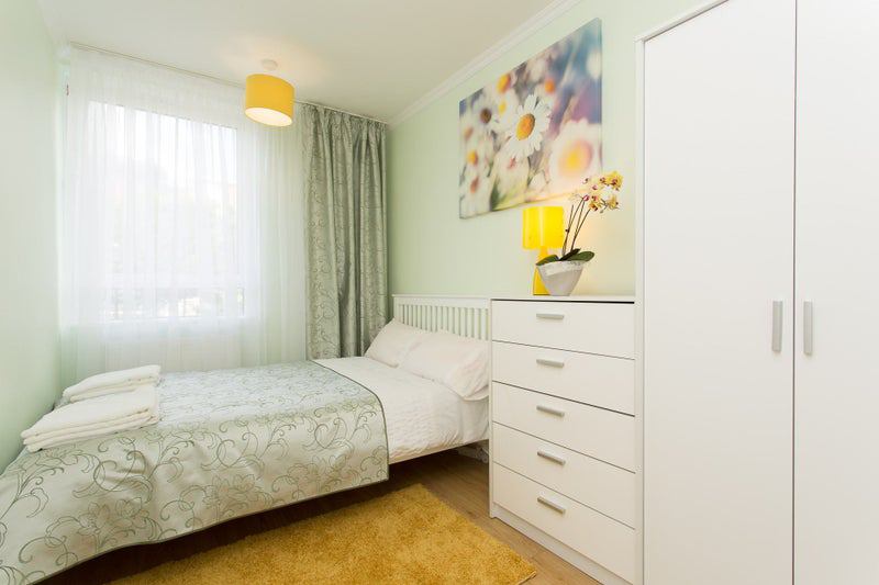 Photo 1: Stylish and Cozy. Wardrobe, chest of drawers, double bed with memory foam mattress