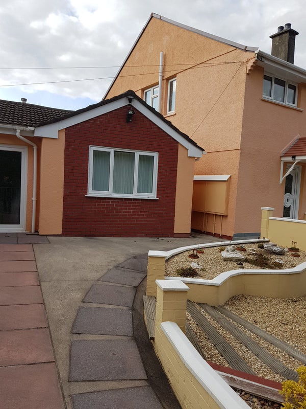 Photo 1: house with front yard