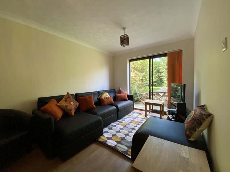 Photo 1: Living room opens to garden