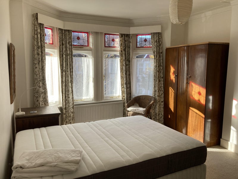 Photo 1: The available bedroom, 1st photo, brand new mattress, overlooking quiet street.