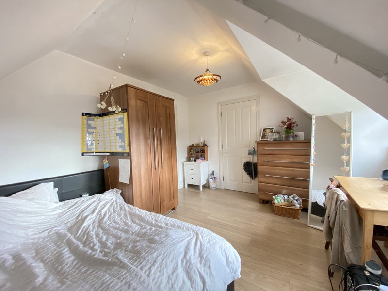 Photo 1: One side of the room with the comfy double bed, wardrobe and chest of drawers