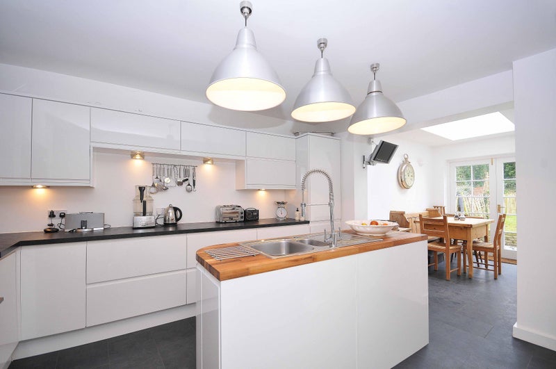 Photo 1: Kitchen and dining area