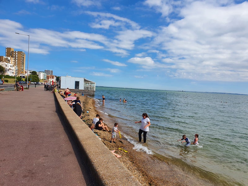 Photo 1: Beach just a minute walk away