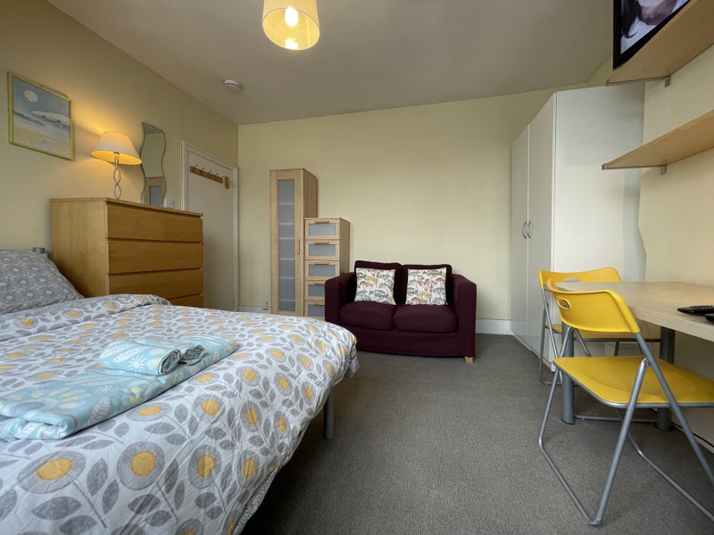 Photo 1: Spacious, light & bright double bedroom with sofa, 2 double wardrobes, chest of draws, table & chair