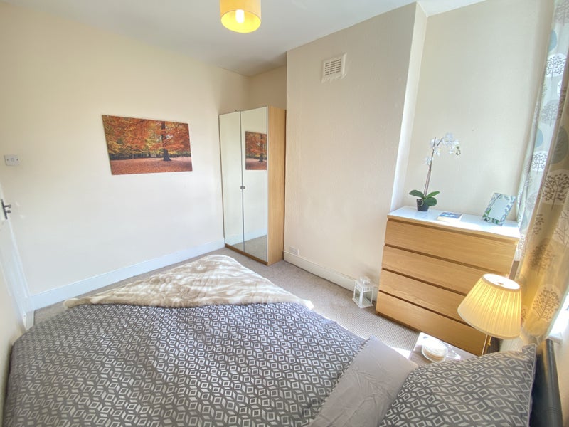Photo 1: Beautiful room with full sized wardrobe (mirrored), chest of drawers, and gas lift storage bed