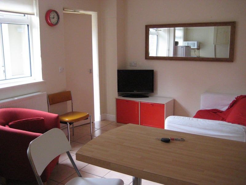 Photo 1: Open Plan showing TV