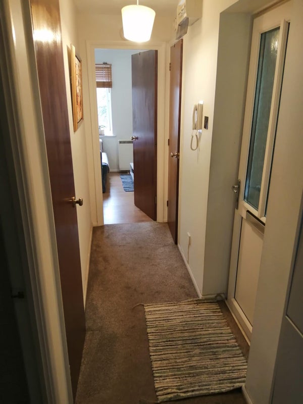 Photo 1: Entrance with new intercom system.