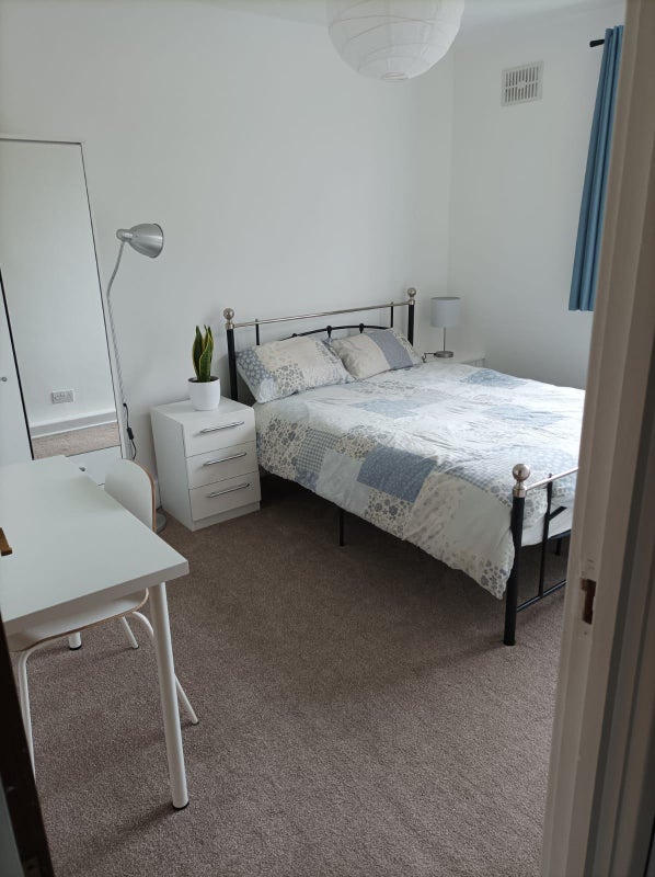 Photo 1: Bedroom for rent. Double bed with a memory foam mattress, blackout thermal curtains, a wardrobe that