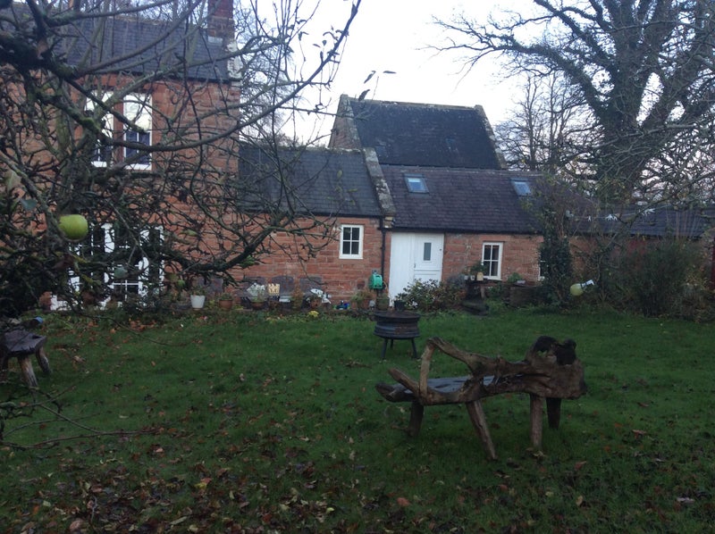 Photo 1: Back garden view of annexe(2 single story buildings on RHS)