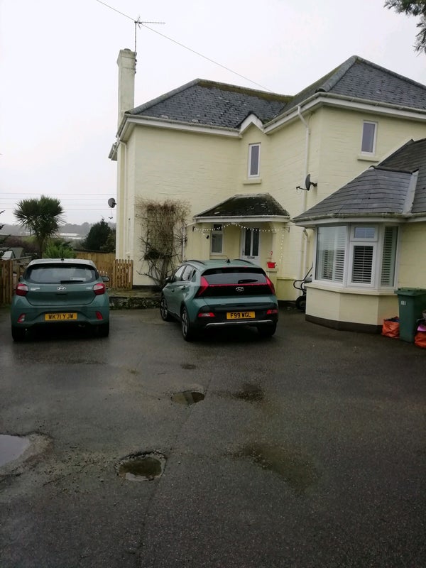 Photo 1: Out side of road parking