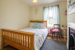 Photo 1: smaller bedroom 