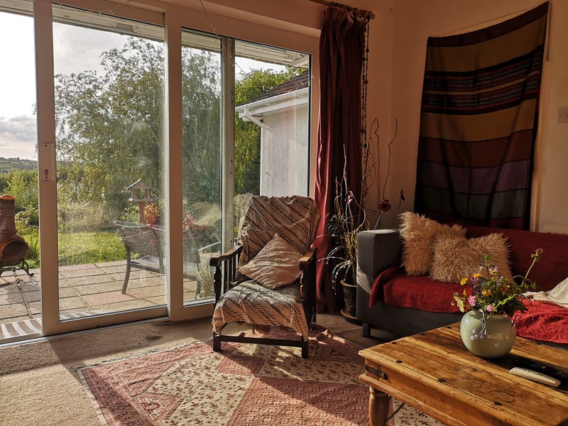 Photo 1: Living room & patio