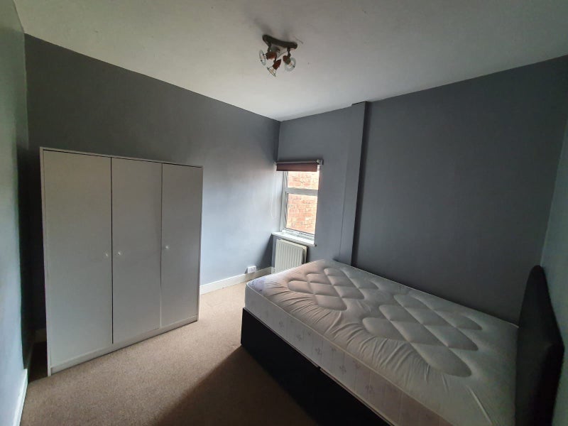 Photo 1: Large double bedroom with bed and wardrobe