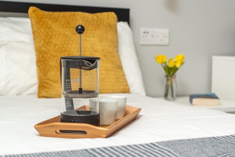 Photo 1: French Press On Bed