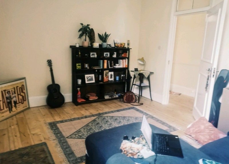 Photo 1: We feel blessed to have such a spacious lounge. It has space for 2 desks and lots of storage!