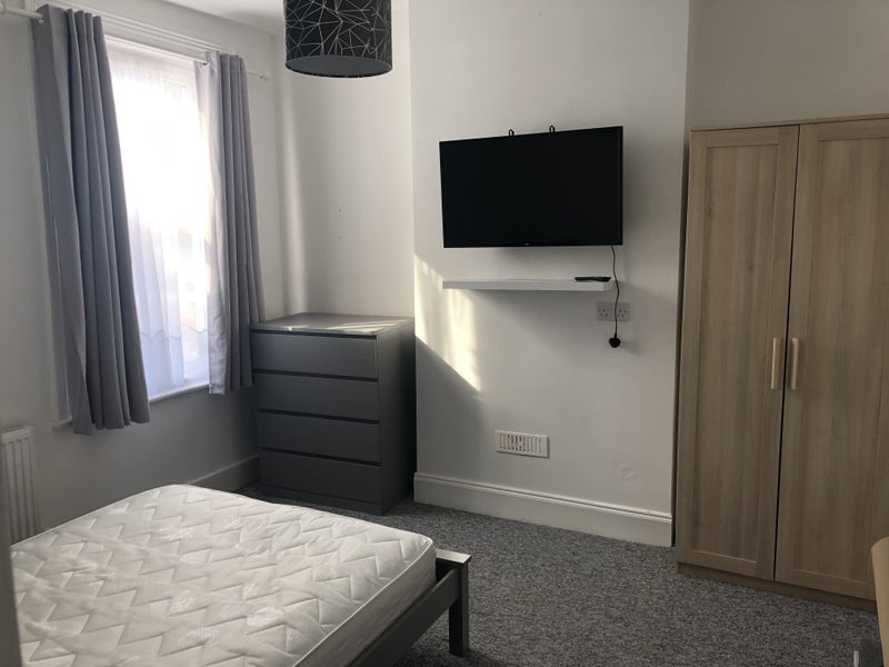 Photo 1: Bedroom with TV