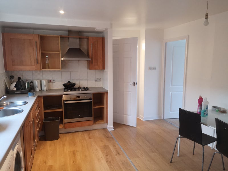 Photo 1: Kitchen is large and has a dining table.