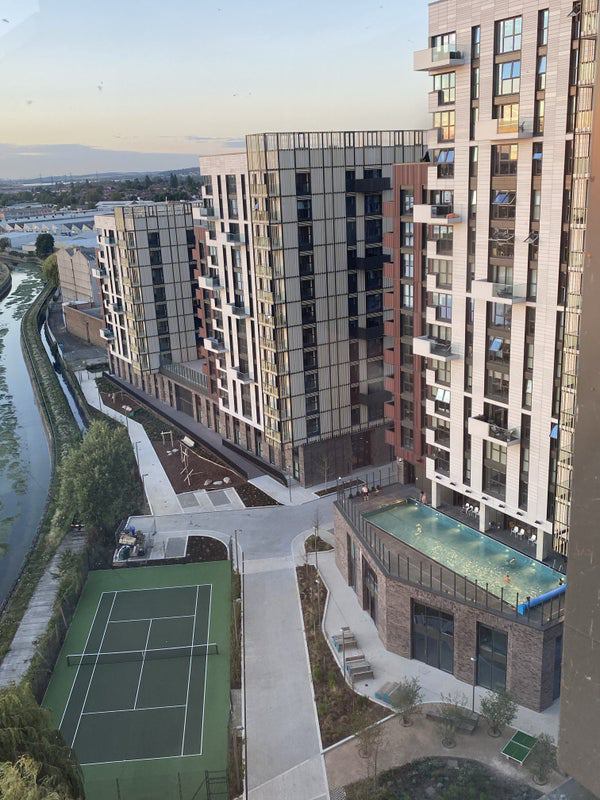Photo 1: View of apartment complex