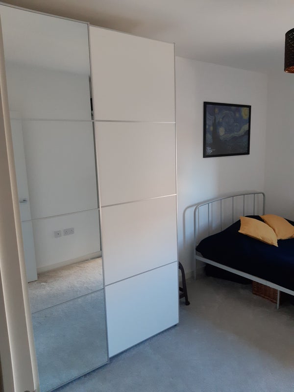 Photo 1: Double wardrobe with moving mirrored doors