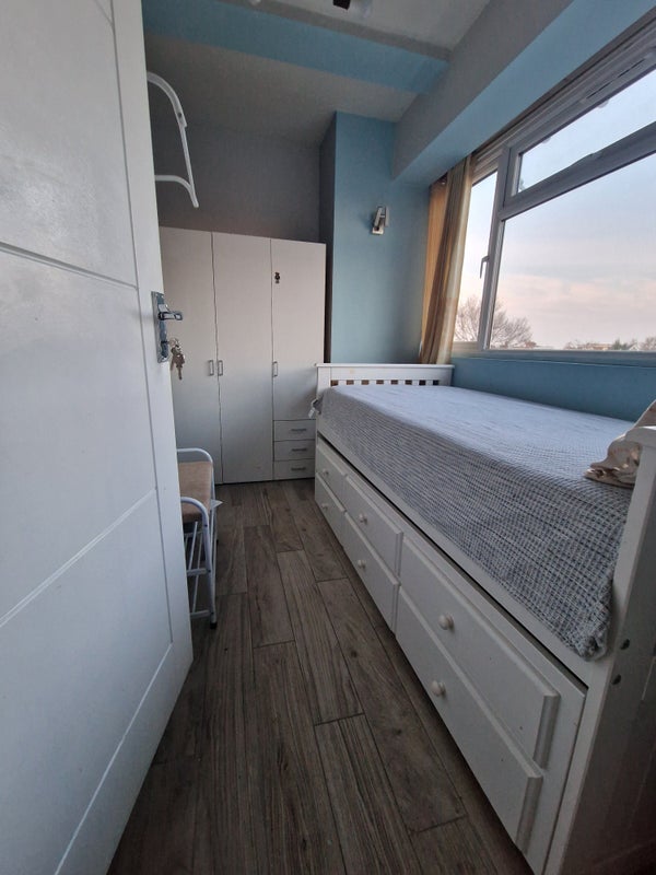 Photo 1: Plenty of storage space with wardrobe and under bed storage.