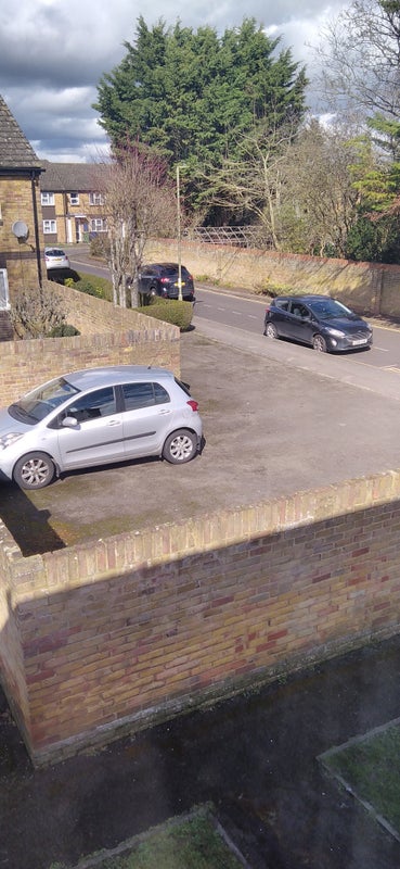 Photo 1: Off street parking 