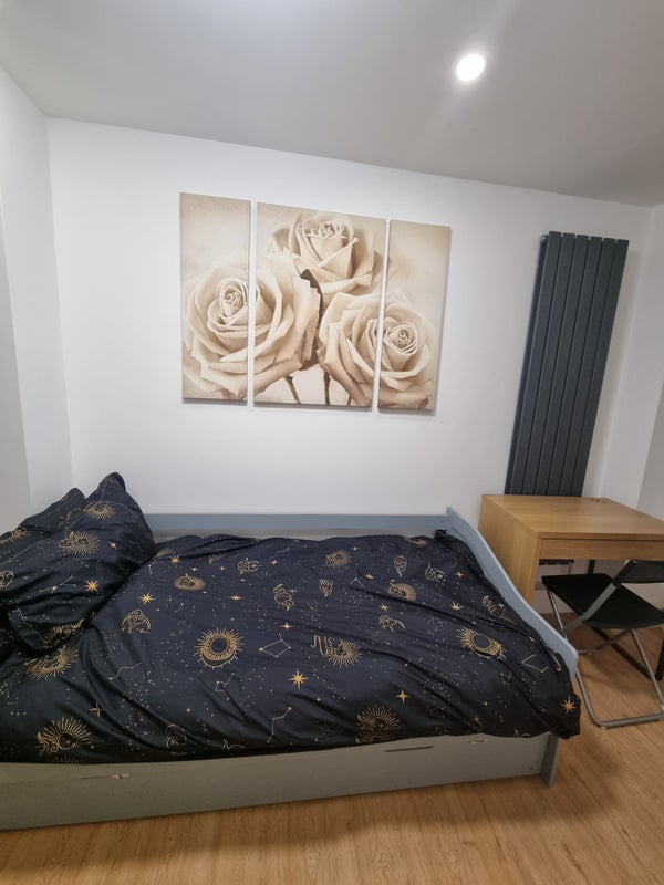 Photo 1: Angle 1 of bed and desk