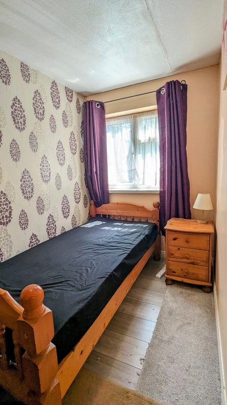 Photo 1: Single bed with bedside table and lamp