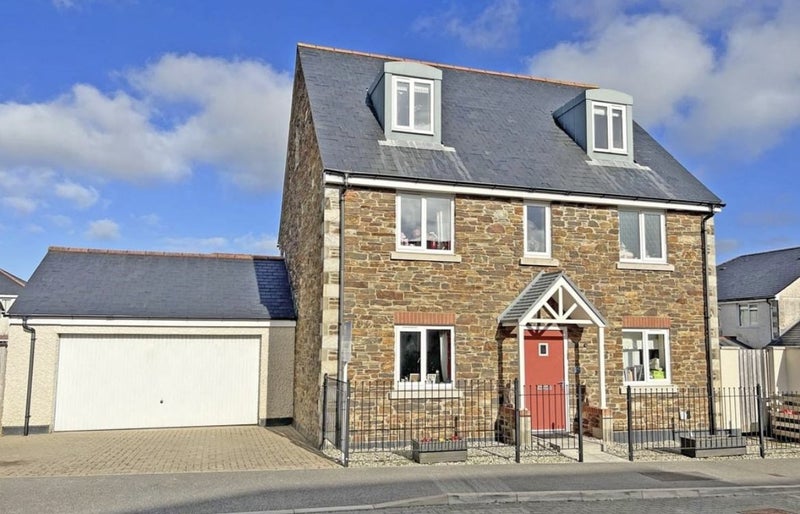 Photo 1: Bedroom top left window. Front of house. 