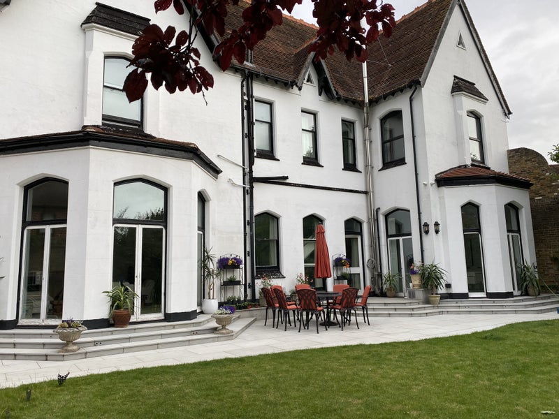 Photo 1: Patio with flowers and lawn