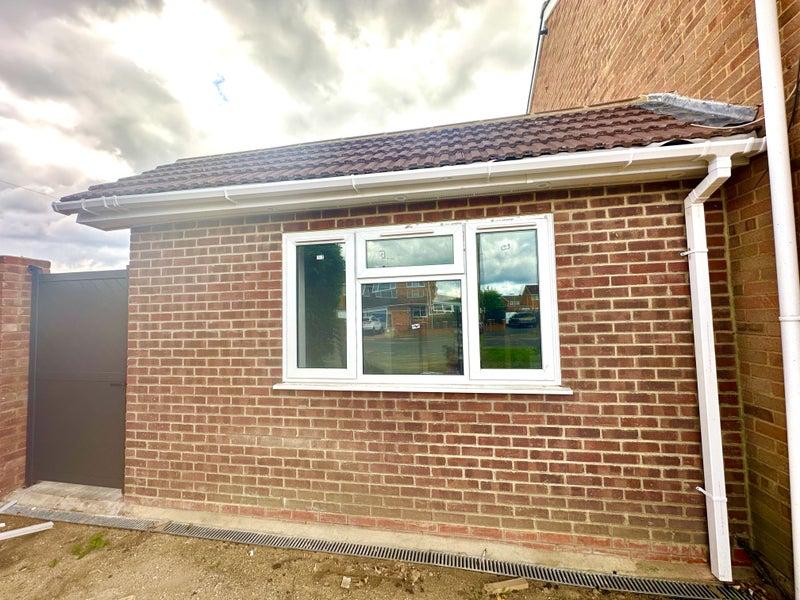 Photo 1: Outside View of the Annexe with gated entrance