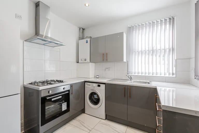 Photo 1: Kitchen (Left side)