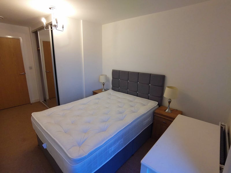 Photo 1: Double bedroom with large built in wardrobe
