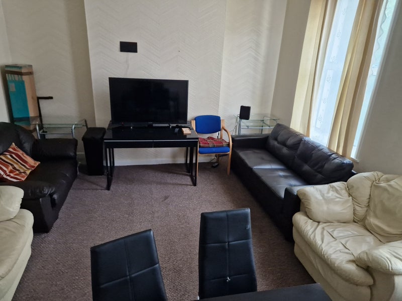 Photo 1: Large lounge with dinning table