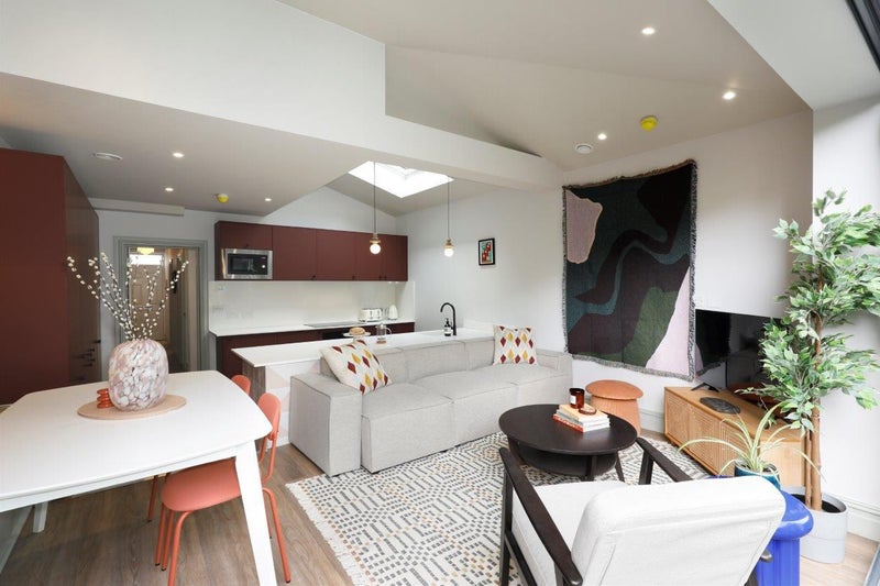 Photo 1: Kitchen / Living Area