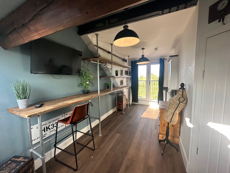 Photo 1: Bedroom 6 kitchenette & balcony (pic A)