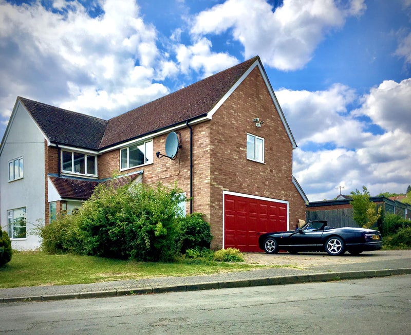 Photo 1: Front of house / parking