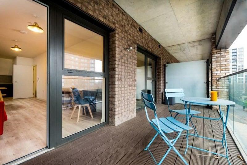 Photo 1: Balcony and Living Room View