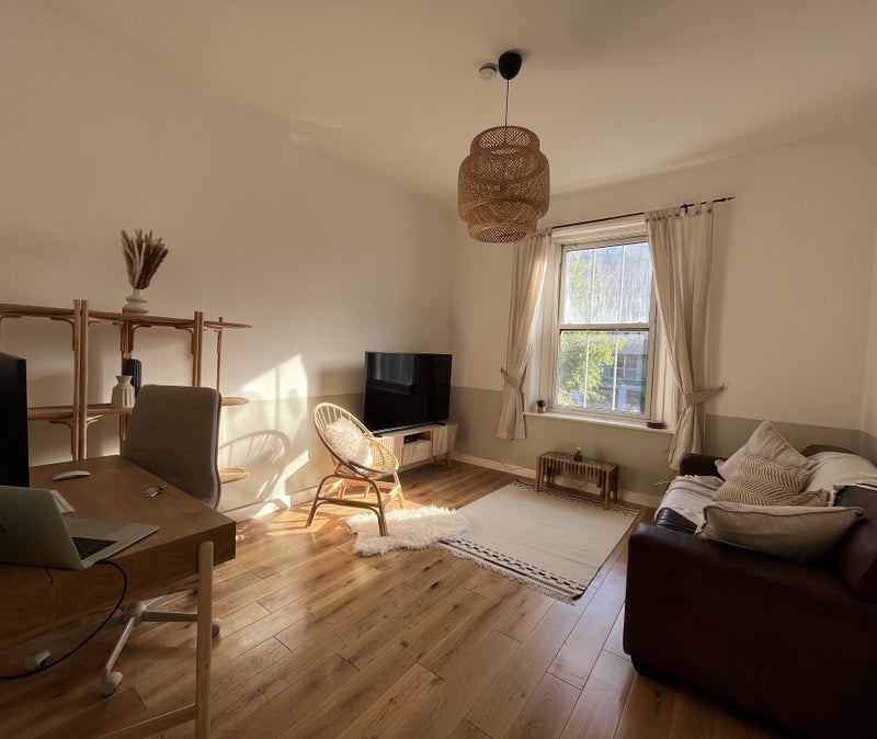 Photo 1: Tastefully furnished living area